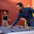 People playing Cornilleau Hyphen Outdoor pool table.