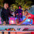 People playing Cornilleau Hyphen Outdoor pool table.