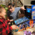 Family playing on the Pinball Micro.