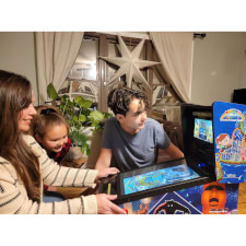 Family playing on the Pinball Micro.