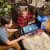Family playing on the Pinball Micro.