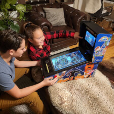 Family playing on the Pinball Micro.