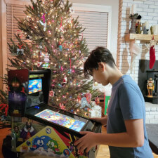 Family playing on the Pinball Micro.