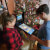 Family playing on the Pinball Micro.