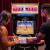 People playing Arcade1Up NBA Jam machine.