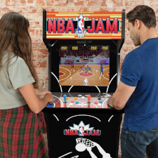 People playing Arcade1Up NBA Jam machine.