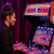 Girl playing Arcade1Up NBA Jam machine.