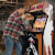 People playing Arcade1Up NBA Jam machine.