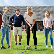 People playing Croquet Pro 4-Mallet set.