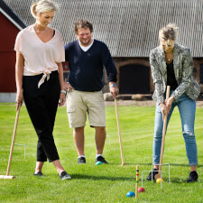 People playing Croquet Pro 4-Mallet set.