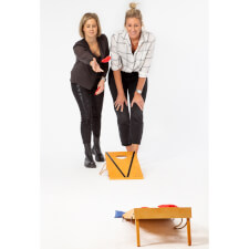 People playing Cornhole Bean Bag game.