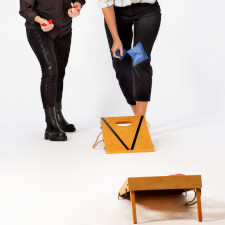 People playing Cornhole Bean Bag game.