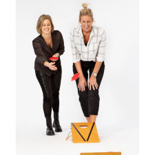 People playing Cornhole Bean Bag game.