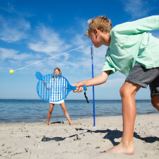 Kids playing Tether Ball game.