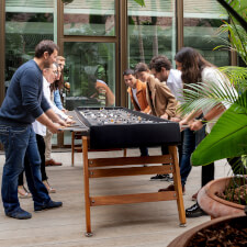 People playing RS Max Football Table in Black.