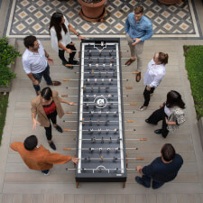 People playing RS Max Football Table in Black.