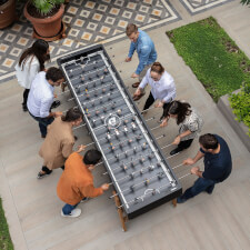People Playing RS Max Football Table in Black.