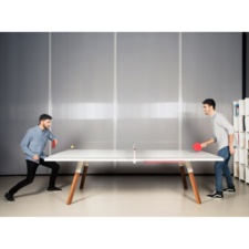 People Playing You and Me Tennis Table.