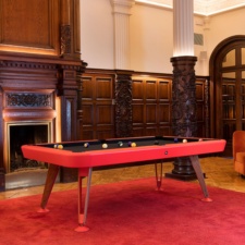 Diagonal Indoor Pool Table in Red with Black Cloth.
