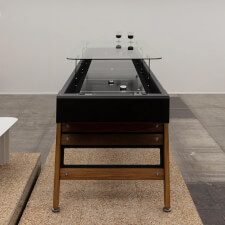 The Track Dining Shuffleboard Table in black.
