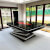 The Harmani pool table in glossy black with red cloth and triagle top.