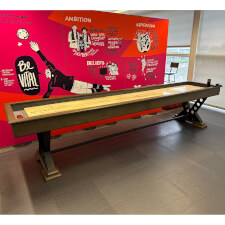 The Vienna 12ft Shuffleboard Table installed in a room.