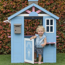A Kid playing in the Icecream playhouse.