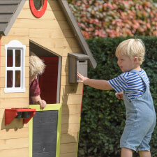 Kids playing in the Fairytale playhouse.
