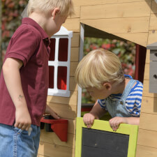 Kids playing in the Fairytale playhouse.