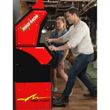 People playing  A1Up Ridge Racer arcade machine.