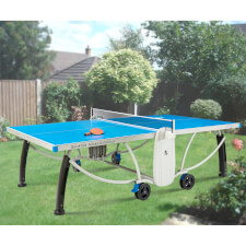 The Quickfold Advance Outdoor tennis table outside in a garden.