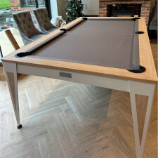 The Pureline Blade Pool Table in a white/oak finish and grey cloth.