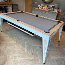 The Pureline Blade Pool Table in a white/oak finish and grey cloth.