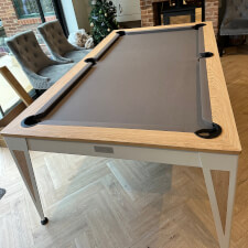 The Pureline Blade Pool Table in a white/oak finish and grey cloth.
