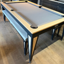 The Pureline Blade Pool Table in a black/oak finish and grey cloth.