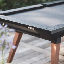 The Cornilleau Origin Outdoor Pool Table Black corner.