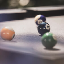 The Cornilleau Origin Outdoor Pool Table Black playing surface.