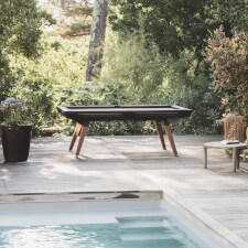 The Cornilleau Origin Outdoor Pool Table Black playing surface.