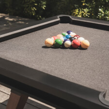 The Cornilleau Origin Outdoor Pool Table Black pocket.