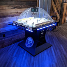 The SEGA Super Chexx Pro Arcade machine with LED lighting in blue.