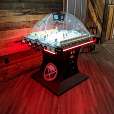 The SEGA Super Chexx Pro Arcade machine with LED lighting in red.