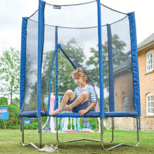 Kid playing on the Plum 6ft junior Springsafe trampoline and enclosure in blue.