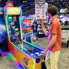 Man playing Jet-Hoops Beer-Pong Game Arcade Machine