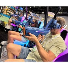 People playing Alpha Ops VR Strike Arcade Machine.