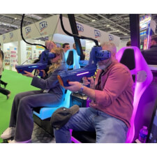 People playing Alpha Ops VR Strike Arcade Machine.