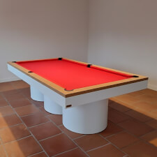 The Rome Slate Bed pool table in matte white finish and red cloth.