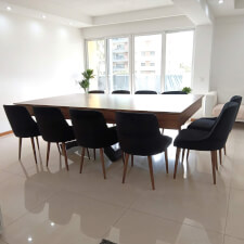 The Bis Slate Bed Pool Table in Walnut finish converted in dining table with chairs.