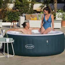 People enjoying the Lay-Z-Spa New York Hot Tub.