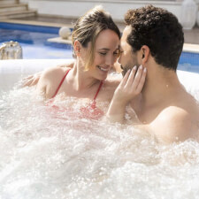People enjoying the Lay-Z-Spa Hollywood AirJet Hot Tub.