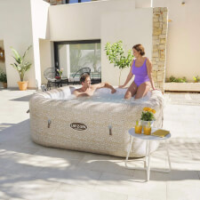 Couple enjoying Lay-Z-Spa Tuscany Airjet Hot Tub.